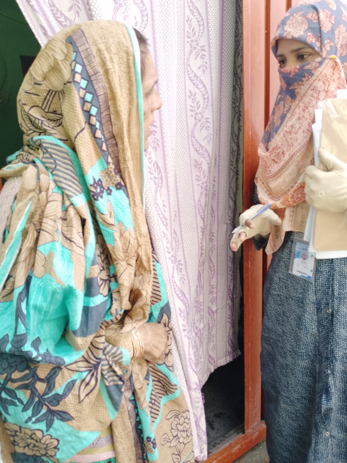 Field surveyor interviewing resident - Click Karachi data collection