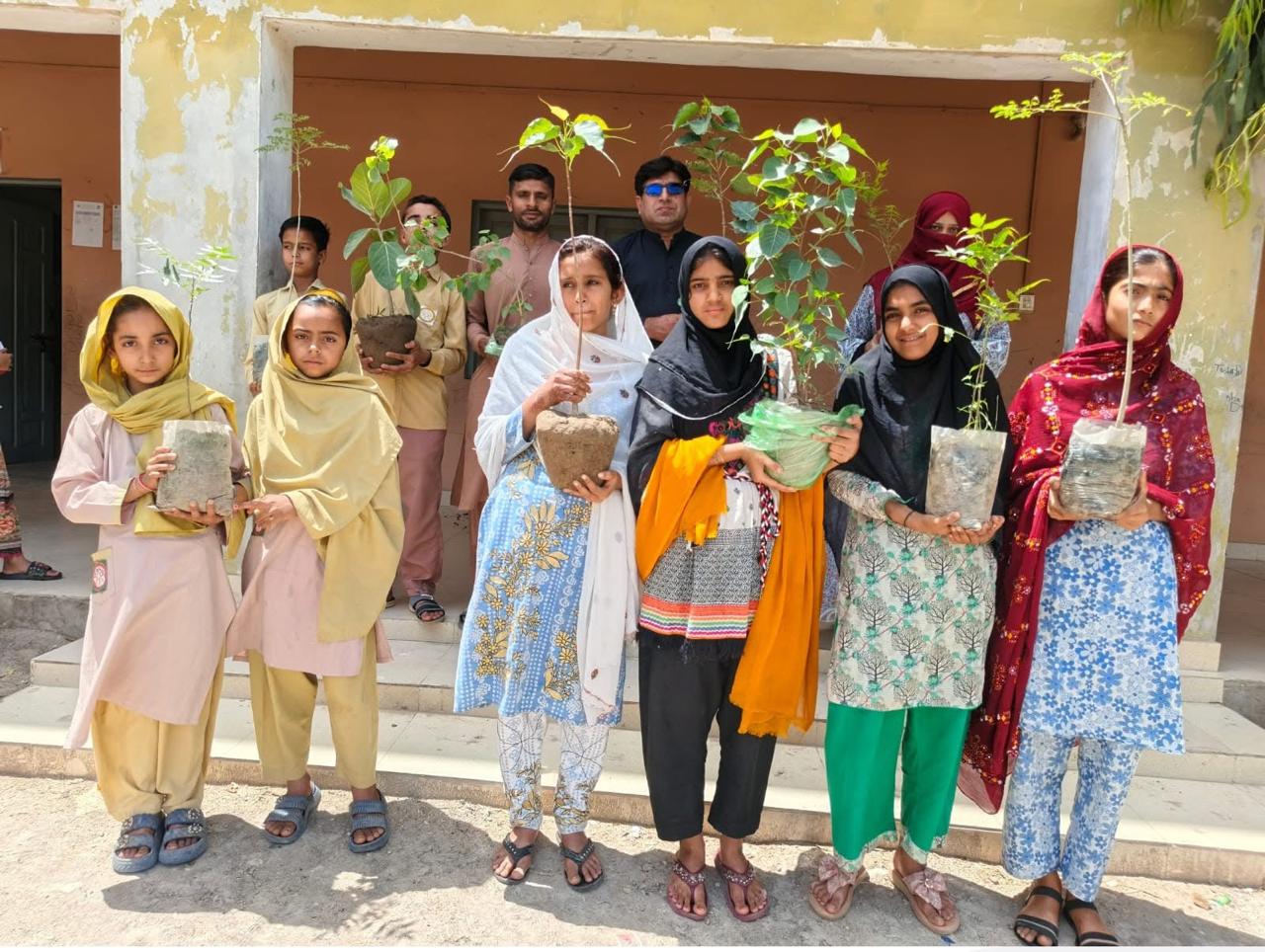 Students with tree saplings - school plantation drive